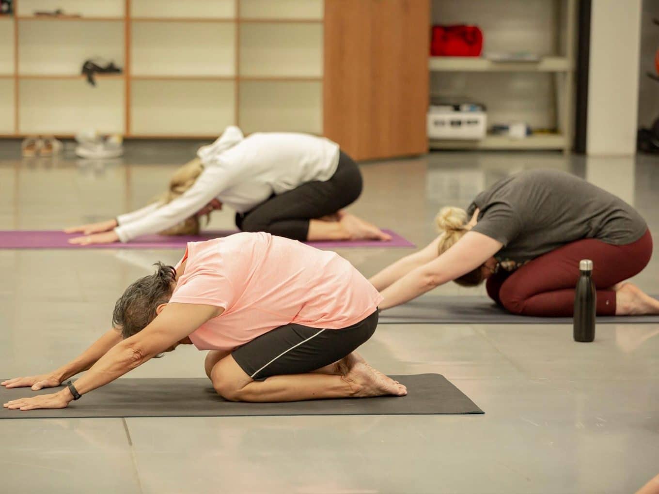 Three women in yoga class